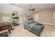 Large bonus room with a ceiling fan, TV, sofa, and a treadmill at 511 Pembroke Ln, Waxhaw, NC 28173