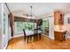 Cozy dining area with vaulted ceiling, natural light, and convenient access to outdoor space at 511 Pembroke Ln, Waxhaw, NC 28173