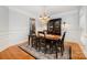 Elegant dining room featuring hardwood floors, wainscoting, and chandelier lighting for formal meals at 511 Pembroke Ln, Waxhaw, NC 28173