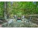 Inviting fire pit area with seating, set within a peaceful, tree-shaded backyard at 511 Pembroke Ln, Waxhaw, NC 28173