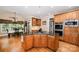 Charming kitchen with wooden cabinets, granite countertops, stainless steel appliances, and breakfast area at 511 Pembroke Ln, Waxhaw, NC 28173