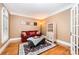 Cozy living room featuring hardwood floors, a sofa, and natural light at 511 Pembroke Ln, Waxhaw, NC 28173