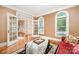 Cozy living room with hardwood floors, neutral walls, and French doors to add natural light at 511 Pembroke Ln, Waxhaw, NC 28173