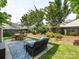 Inviting backyard with comfortable outdoor seating and garden at 5304 Silabert Ave, Charlotte, NC 28205