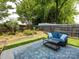Well-manicured backyard with outdoor seating and attractive landscaping at 5304 Silabert Ave, Charlotte, NC 28205