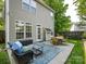 Spacious backyard with an outdoor seating area and well-maintained lawn at 5304 Silabert Ave, Charlotte, NC 28205