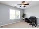 Bedroom with neutral walls, ceiling fan, and a large window for ample natural light at 5304 Silabert Ave, Charlotte, NC 28205