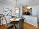Dining room with round table and 4 chairs, next to the kitchen area. Natural light from the windows at 5304 Silabert Ave, Charlotte, NC 28205