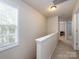 Well-lit hallway features neutral walls, carpeted floors, and a bright window view at 5304 Silabert Ave, Charlotte, NC 28205