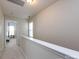 Carpeted hallway features neutral walls and leads to a bedroom with natural light at 5304 Silabert Ave, Charlotte, NC 28205