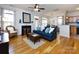Open-concept living room with hardwood floors and ample seating at 5304 Silabert Ave, Charlotte, NC 28205