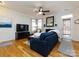 Comfortable living room with hardwood floors, fireplace, and backyard access at 5304 Silabert Ave, Charlotte, NC 28205