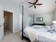 Comfortable main bedroom featuring light gray walls, a ceiling fan, and doorway to en suite at 5304 Silabert Ave, Charlotte, NC 28205
