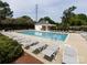 Community pool with lounge chairs, bathroom and picnic area at 5304 Silabert Ave, Charlotte, NC 28205