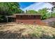 Brick home with a large backyard and a covered patio, perfect for outdoor entertaining at 542 9Th Nw St, Hickory, NC 28601