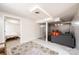Finished basement features an entrance to a bedroom, a comfortable seating area, and neutral decor at 542 9Th Nw St, Hickory, NC 28601