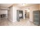 Spacious basement with tile flooring that could be used as a multi-purpose living area at 542 9Th Nw St, Hickory, NC 28601