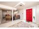 Finished basement featuring seating area, transition to carpeted area, and bright red door entrance at 542 9Th Nw St, Hickory, NC 28601