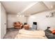 Cozy basement with a chair and ottoman, perfect for relaxing and entertaining guests at 542 9Th Nw St, Hickory, NC 28601