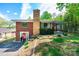 Charming brick home with a unique stacked stone chimney and well-manicured landscaping at 542 9Th Nw St, Hickory, NC 28601