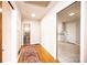 Hallway with wood floors and access to bathroom and kitchen, each accessible through the hallway at 542 9Th Nw St, Hickory, NC 28601