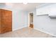 This kitchen features tile floors, white cabinets, light blue walls and a view to the hallway at 542 9Th Nw St, Hickory, NC 28601