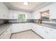 Bright kitchen with ample counter space, white cabinetry, and stainless steel sink at 542 9Th Nw St, Hickory, NC 28601