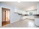 Bright kitchen with white cabinets, tiled floors, and ample counter space at 542 9Th Nw St, Hickory, NC 28601