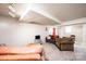Basement living room with carpeted floors, sofa, and tv at 542 9Th Nw St, Hickory, NC 28601