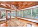 Inviting sunroom with wood ceiling, hardwood floors, and multiple windows offering ample natural light at 542 9Th Nw St, Hickory, NC 28601