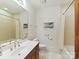 Well-lit bathroom with single vanity and tub/shower combo at 6133 Wakehurst Rd, Charlotte, NC 28226