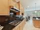 Well-equipped kitchen with stainless steel appliances, dark granite countertops, and plenty of cabinet storage at 6133 Wakehurst Rd, Charlotte, NC 28226