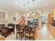 Modern kitchen featuring stainless steel appliances, granite countertops, and stylish island with bar seating at 6133 Wakehurst Rd, Charlotte, NC 28226