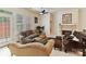 Comfortable living room with a fireplace, plush seating, and ample natural light at 6133 Wakehurst Rd, Charlotte, NC 28226