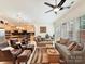 Spacious living room with open floor plan to the kitchen, plush seating, and ample natural light at 6133 Wakehurst Rd, Charlotte, NC 28226