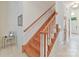 Elegant wooden staircase with white trim, leading to upper level at 6133 Wakehurst Rd, Charlotte, NC 28226