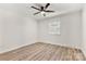 Bedroom featuring wood look floors, a ceiling fan and natural light at 7141 Pitchfork Ln, Mint Hill, NC 28227
