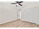 Bedroom features wood look floors, a ceiling fan and closet space at 7141 Pitchfork Ln, Mint Hill, NC 28227