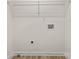 Unfinished laundry room with wood look floors and washer dryer hookups at 7141 Pitchfork Ln, Mint Hill, NC 28227