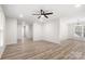 Open-concept living space featuring hard surface floors and neutral paint throughout at 7141 Pitchfork Ln, Mint Hill, NC 28227