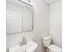 Cozy bathroom featuring a toilet, sink, mirror and white walls at 759 Victory Gallop Ave, Clover, SC 29710