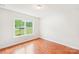 Bright bedroom featuring hardwood floors and a large window overlooking the lawn at 759 Victory Gallop Ave, Clover, SC 29710