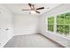 Bedroom with large window, ceiling fan and closet at 759 Victory Gallop Ave, Clover, SC 29710
