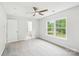 Bright bedroom features neutral walls, plush carpet, and natural light from a large window at 759 Victory Gallop Ave, Clover, SC 29710