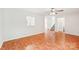 Bright living room featuring wood floors, white walls, and access to the staircase at 759 Victory Gallop Ave, Clover, SC 29710