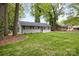 Charming home with a manicured lawn, mature trees, and a well-maintained exterior at 816 Echo Glen Rd, Charlotte, NC 28213