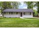Charming home featuring a well-maintained lawn, a classic brick facade, and tasteful shutters enhancing its curb appeal at 816 Echo Glen Rd, Charlotte, NC 28213