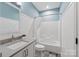 Stylish bathroom featuring white shiplap walls, a shower and tub combo, and a modern vanity at 9217 Rock Water Ct, Waxhaw, NC 28173