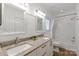 Modern bathroom with granite countertops, double sinks, and a tub/shower combo at 9217 Rock Water Ct, Waxhaw, NC 28173