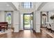 Bright foyer featuring hardwood floors, grand columns, and an open view to the front yard at 9217 Rock Water Ct, Waxhaw, NC 28173